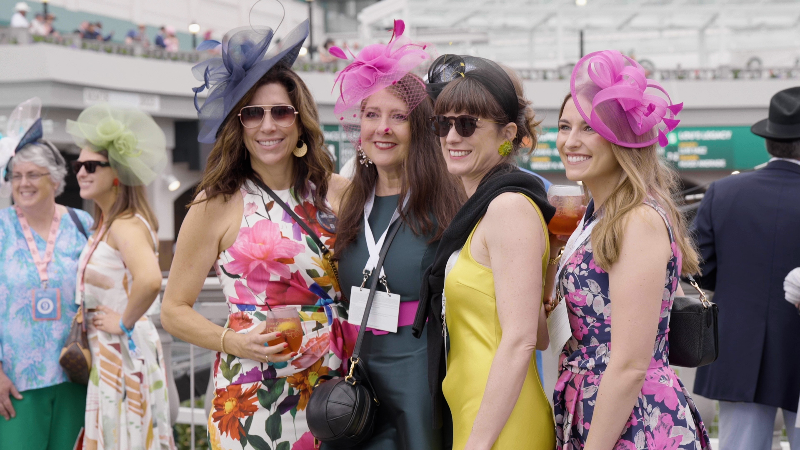 Hats, dapper suits and bright colors shine in Kentucky Derby fashion at Churchill Downs