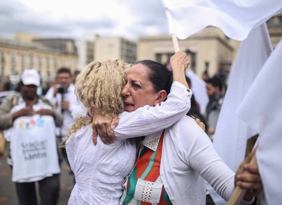 Colombians celebrate the signing of a new peace deal