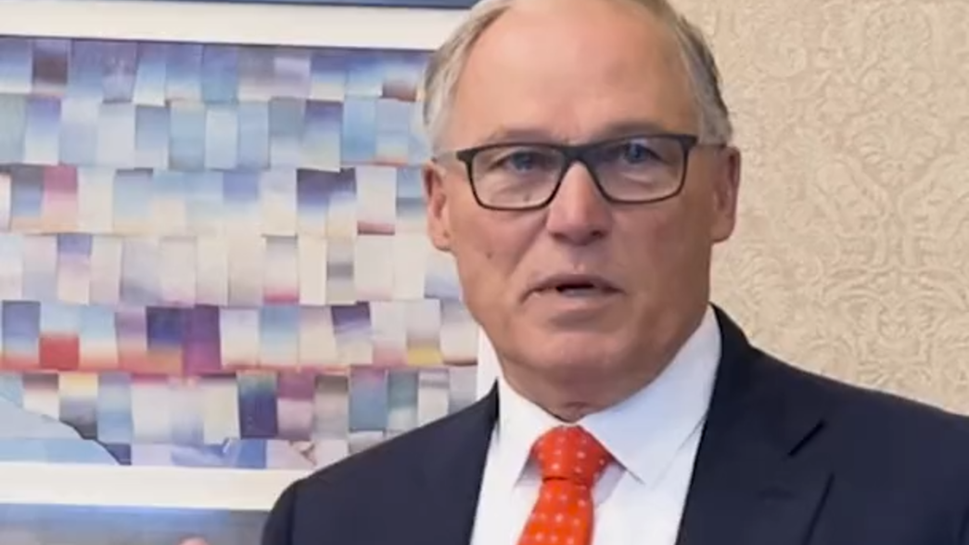 Gov. Jay Inslee discusses some of the art hanging in his office