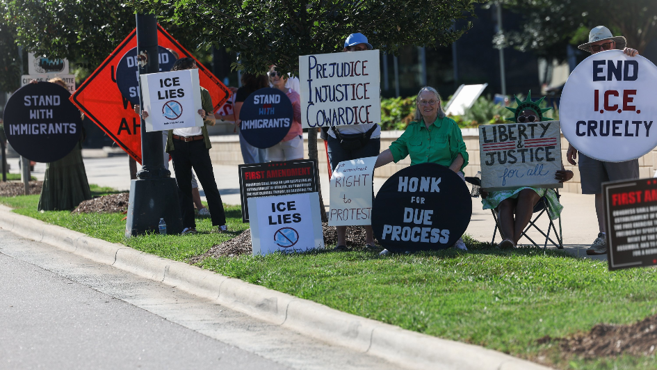 Supporters gather to protest during DHS assault trial