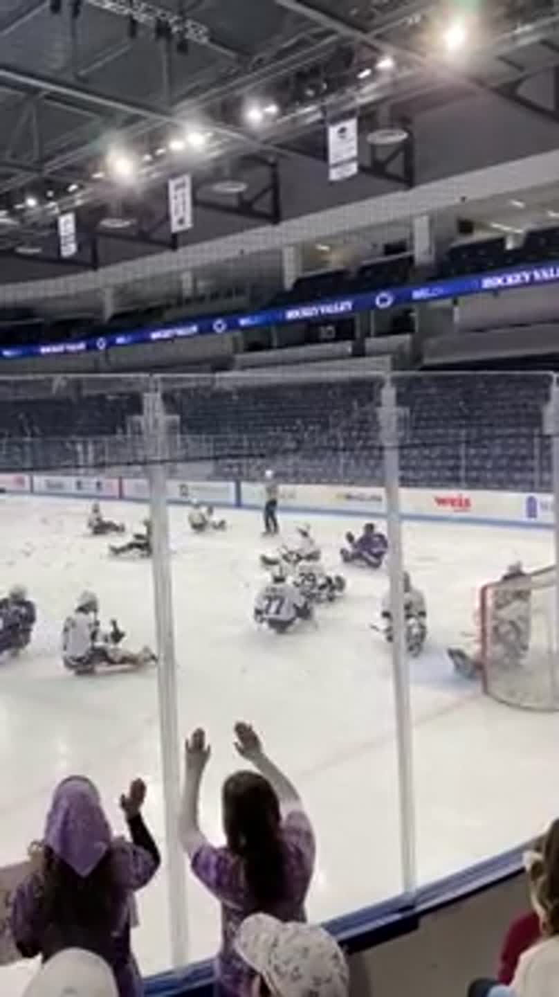 Fans celebrate State College Coyotes goal during Penn State Sled Hockey Classic