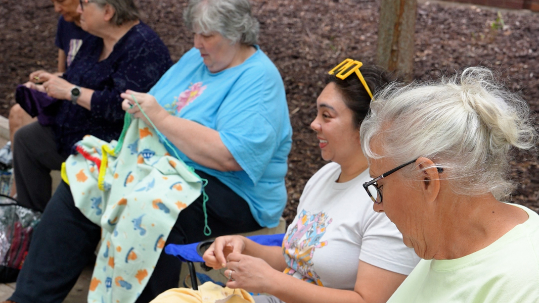 Mending group repairs fabric and builds connections