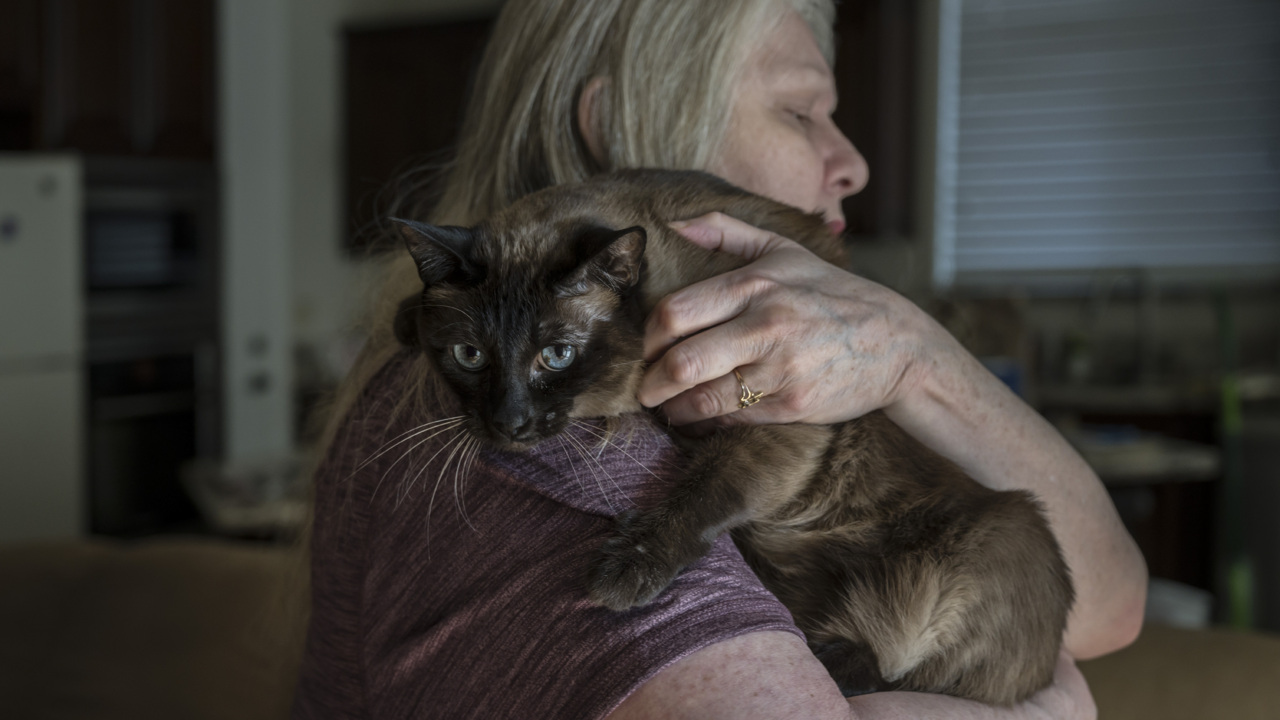 See how this woman and her cat survived as homes burned around her