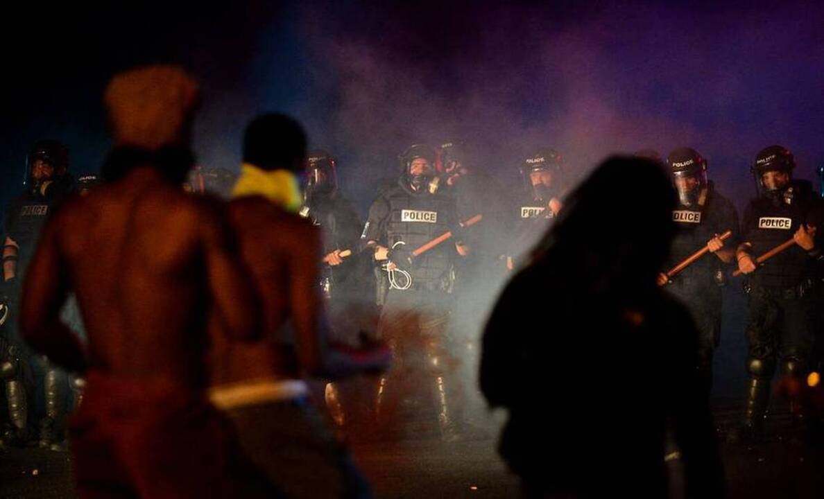 Charlotte protesters flee from tear gas in confrontation with police