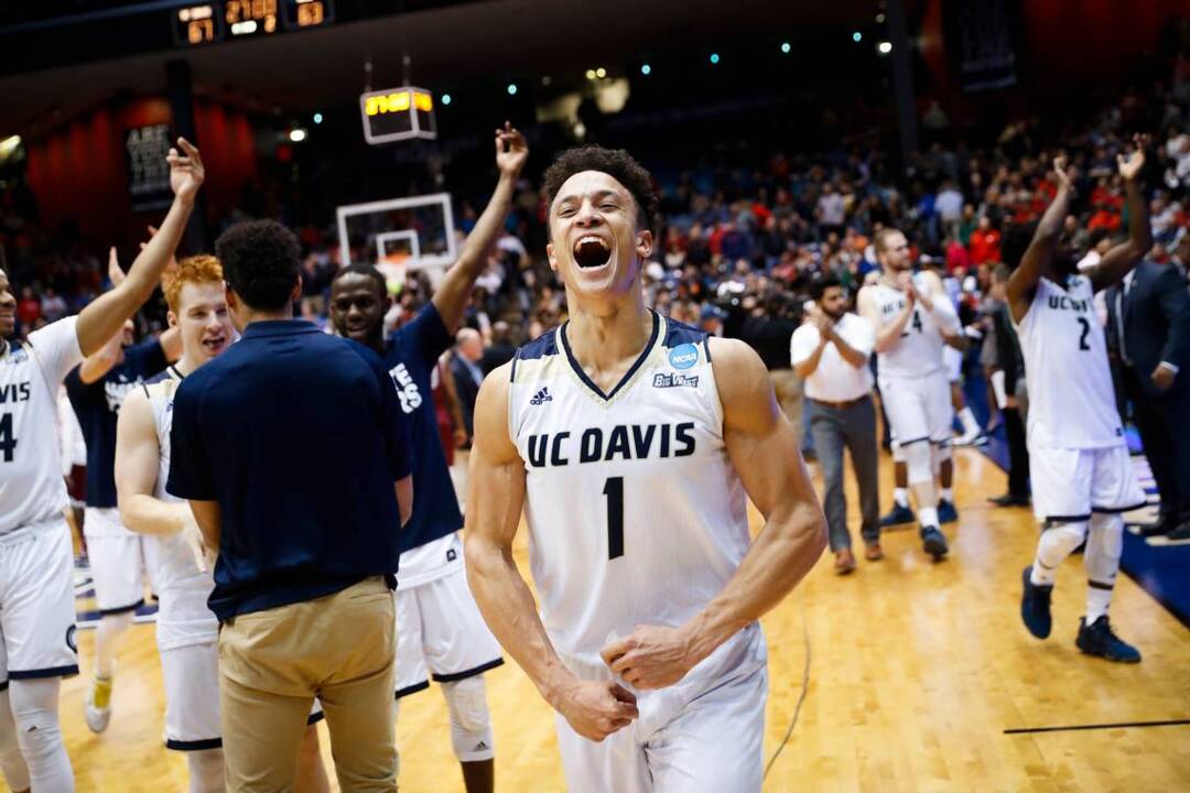 UC Davis guard Lawrence White buys souvenir T-shirt to celebrate NCAA win