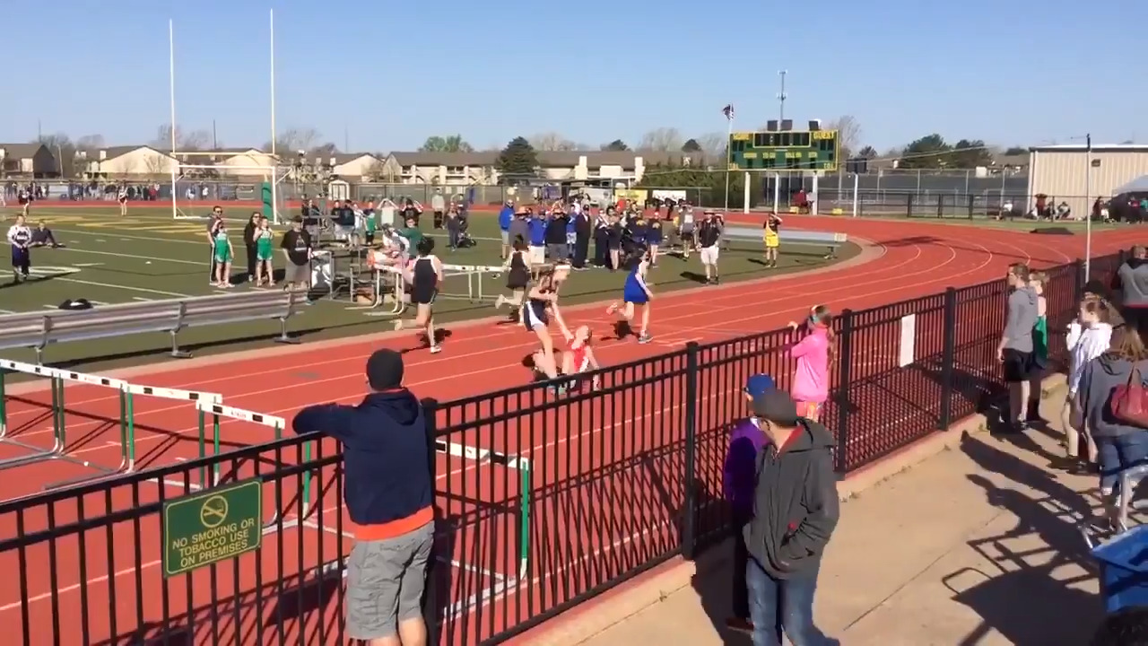 Middle-school hurdler gives up lead to help her fallen opponent