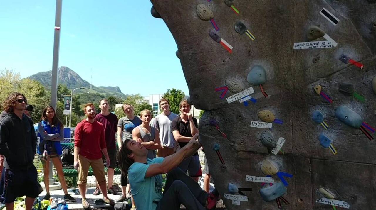 Rock climbing legend Chris Sharma drops in at Cal Poly rock wall