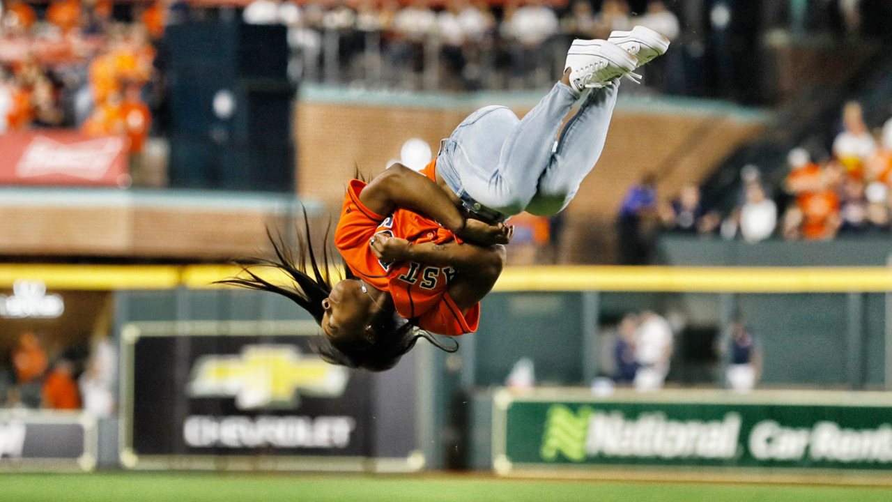 Simone Biles does twisting backflip before throwing first pitch at World Series
