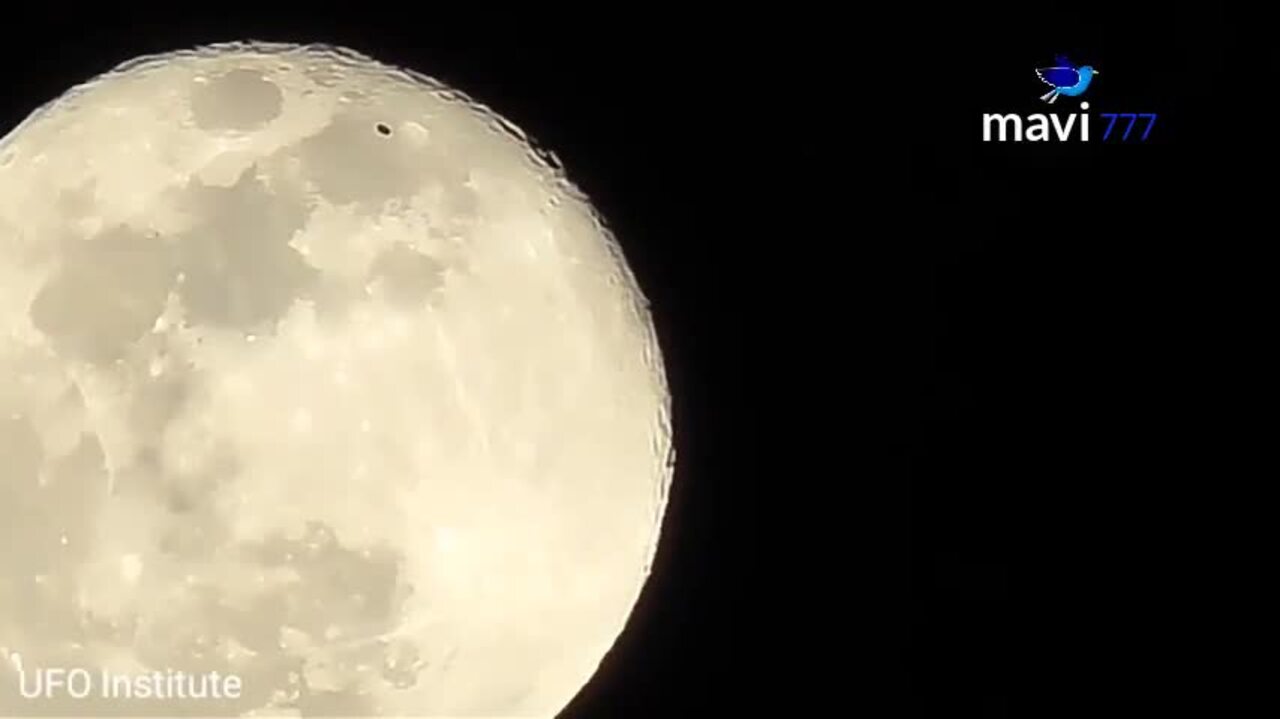 Dark Disk UFO Passes Over Moon