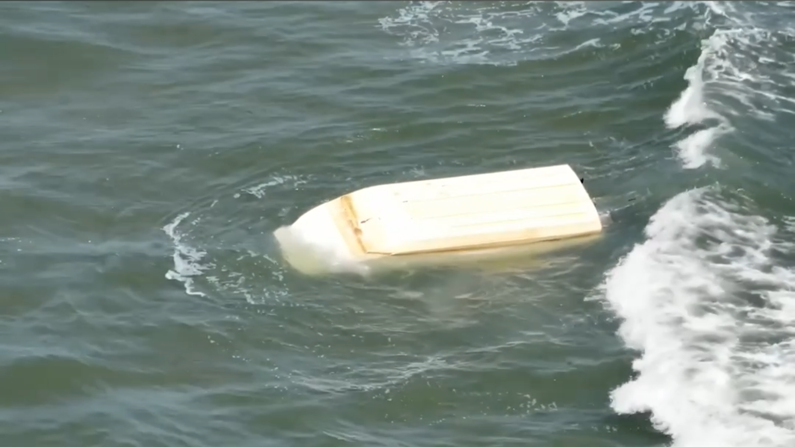 Boat flips, leaving four people in North Carolina inlet