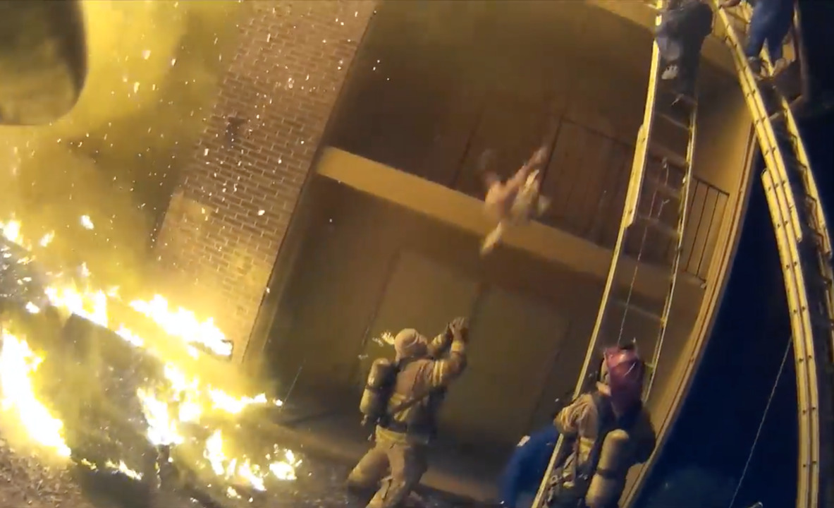 Watch a Georgia firefighter catch a child tossed from a burning ...