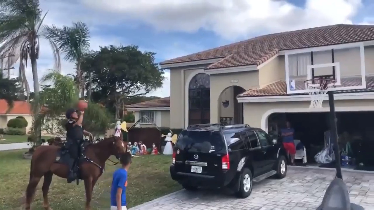 Mounted police officer plays game of Horse