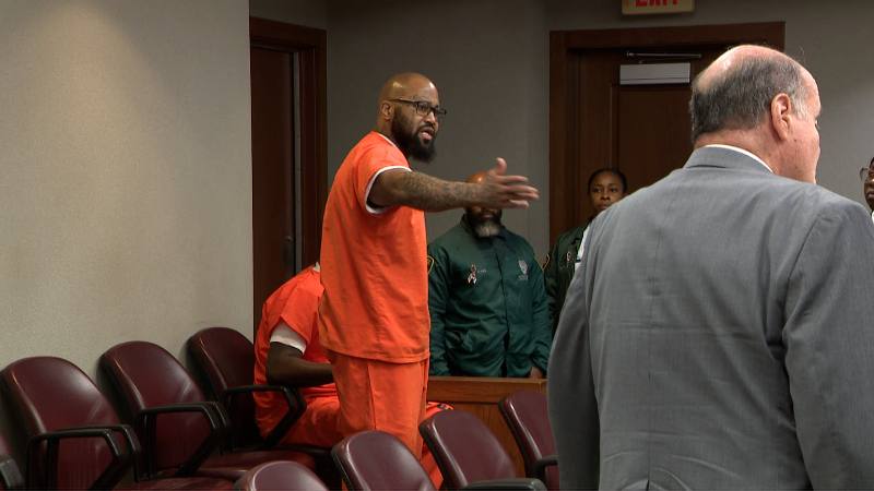 One of the men accused in execution-style murder storms out of court