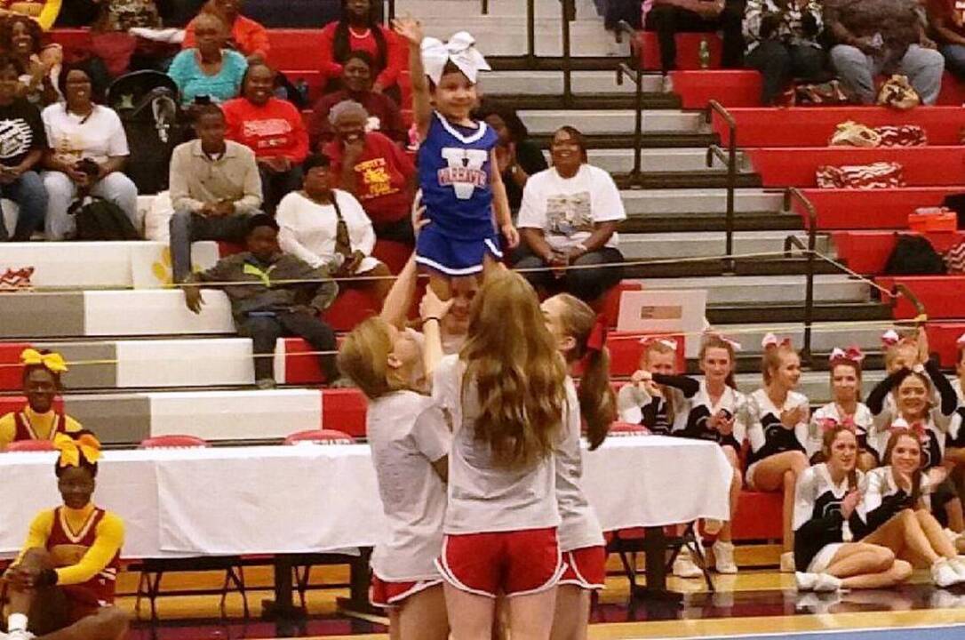 Video: Veterans High School helps sick girl become cheerleader for a day