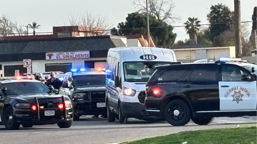 CHP officers surround a medical transport van after a pursuit in Fresno