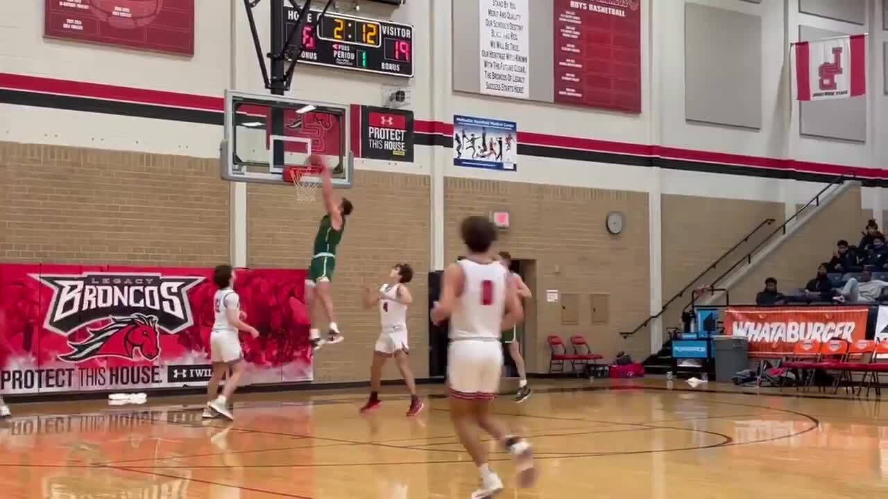Birdville teammates go off back board for the dunk at the Whataburger Tournament