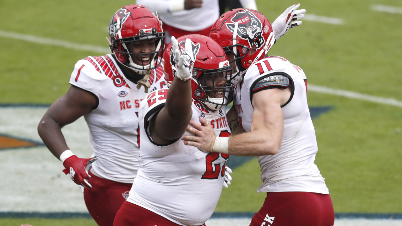 Whoa! Big NC State defensive lineman rumbles or a touchdown. See the video here.
