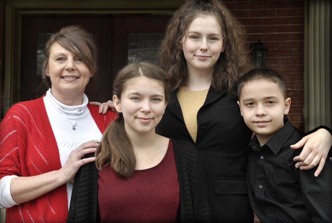 Former JoCo police officer abused as a child adopts three abused kids — her cousins