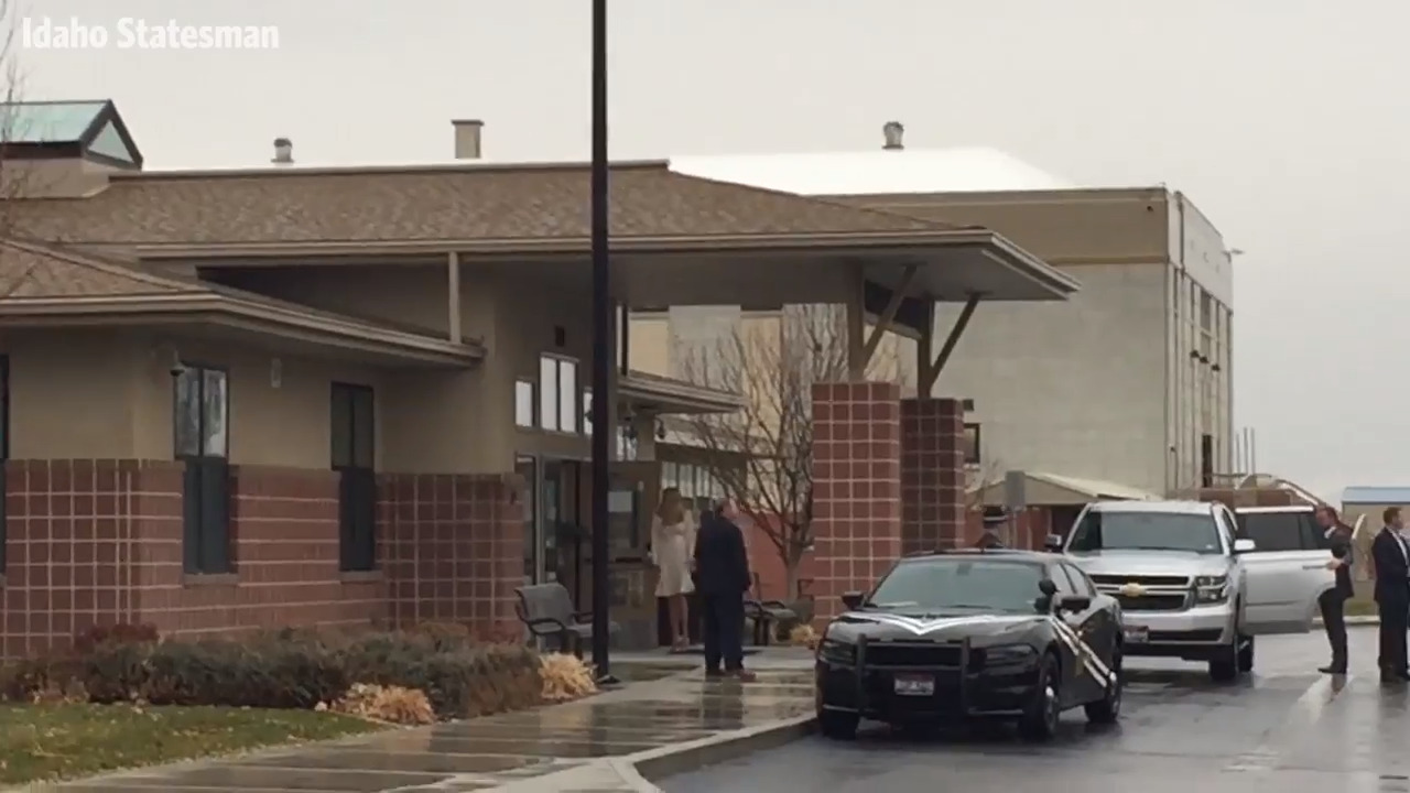 Protesters and supporters greet Ivanka Trump and Tim Cook as they arrive in Wilder