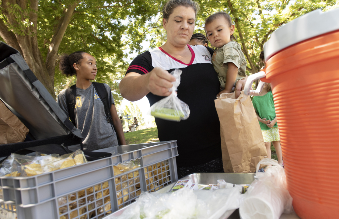 Free lunches don’t end when school’s out. Modesto’s summer program adds books to mix.