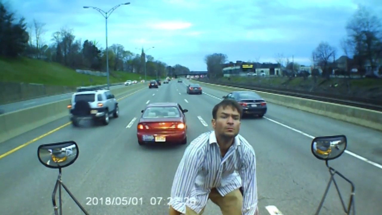 Man stops school bus in traffic, jumps on hood to ask unusual question
