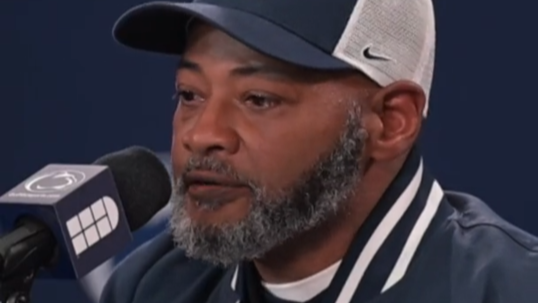 Coach Terry Smith wears pin to acknowledge Joe Paterno