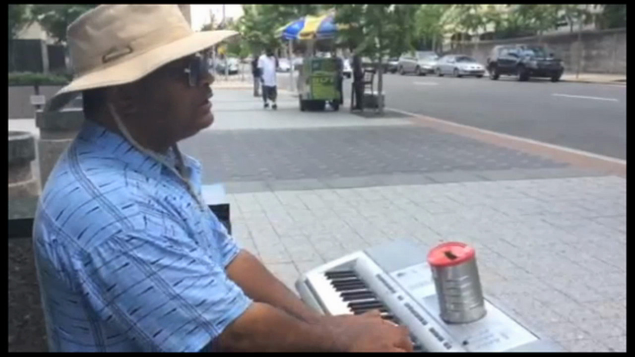 Street musician Phil Walters brings joy through his music