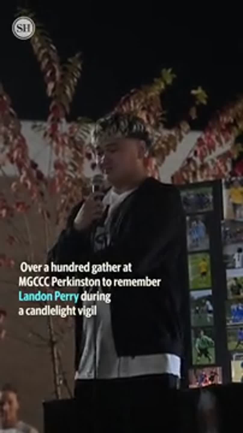 Community members gather for a candlelight vigil to remember Landon Perry