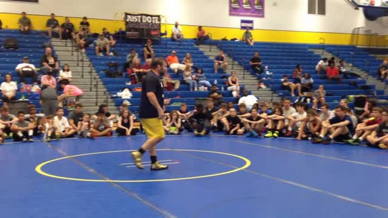 New Queens U. coach, an Olympic wrestler teaches kids in Fort Mill