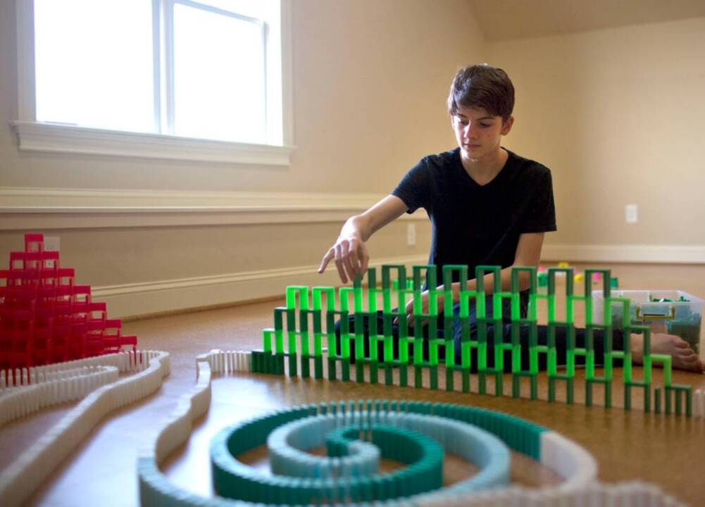 Local teen teaches domino skills to actor Will Smith      