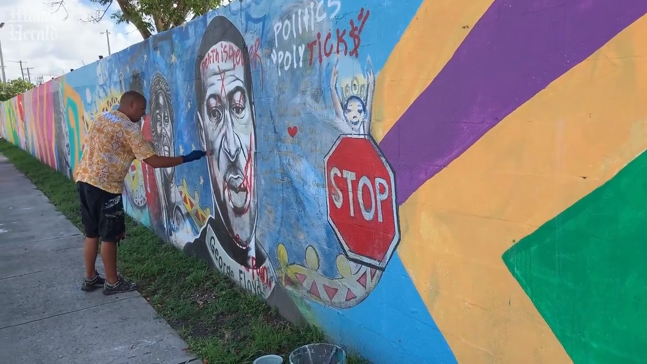 Miami muralist Kyle Holbrook fixes vandalized George Floyd mural