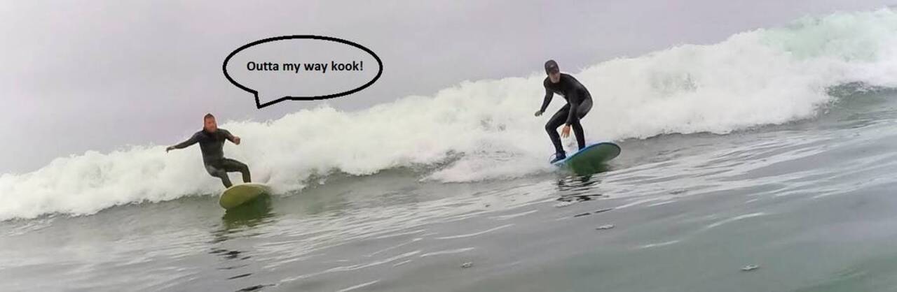 A kook and an experienced surfer try out the waves at Mondos Beach in Ventura