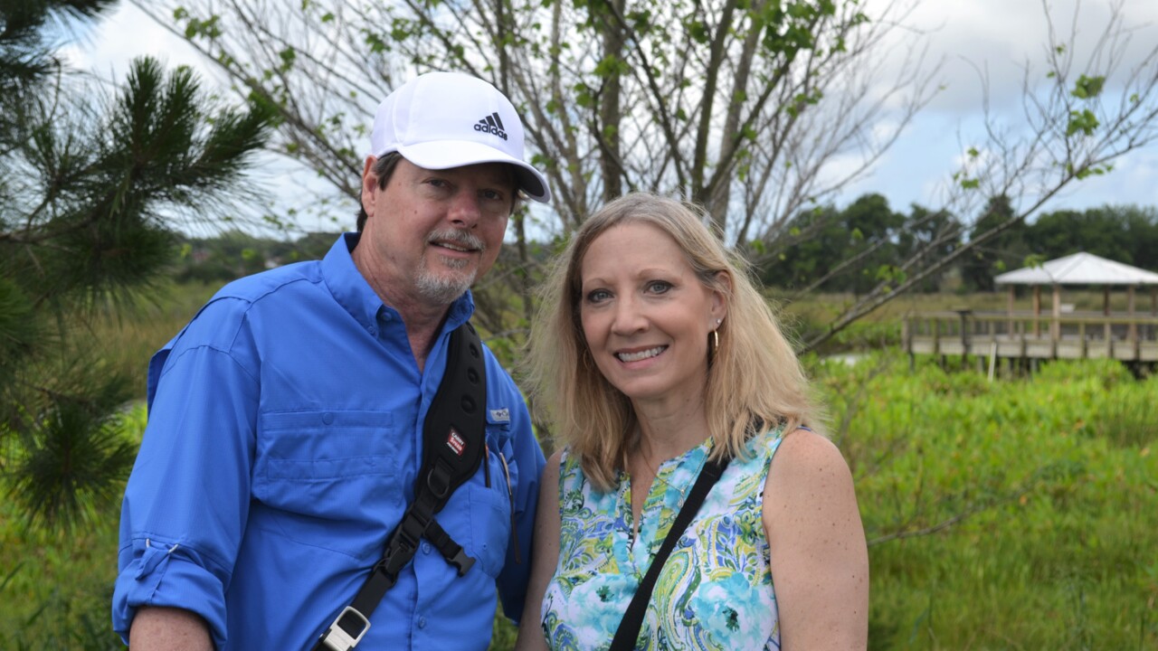 Meet Parrish couple behind viral gator vs. snake photos. It’s brought them worldwide attention