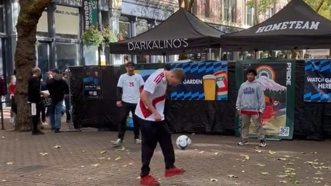 Eric Bell juggling with fans in Pioneer Square before Egypt-Iran World Cup match in Seattle