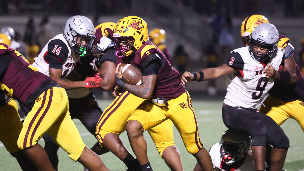 West Charlotte's Emory McClain, coach DJ McFadden talk after win over Butler
