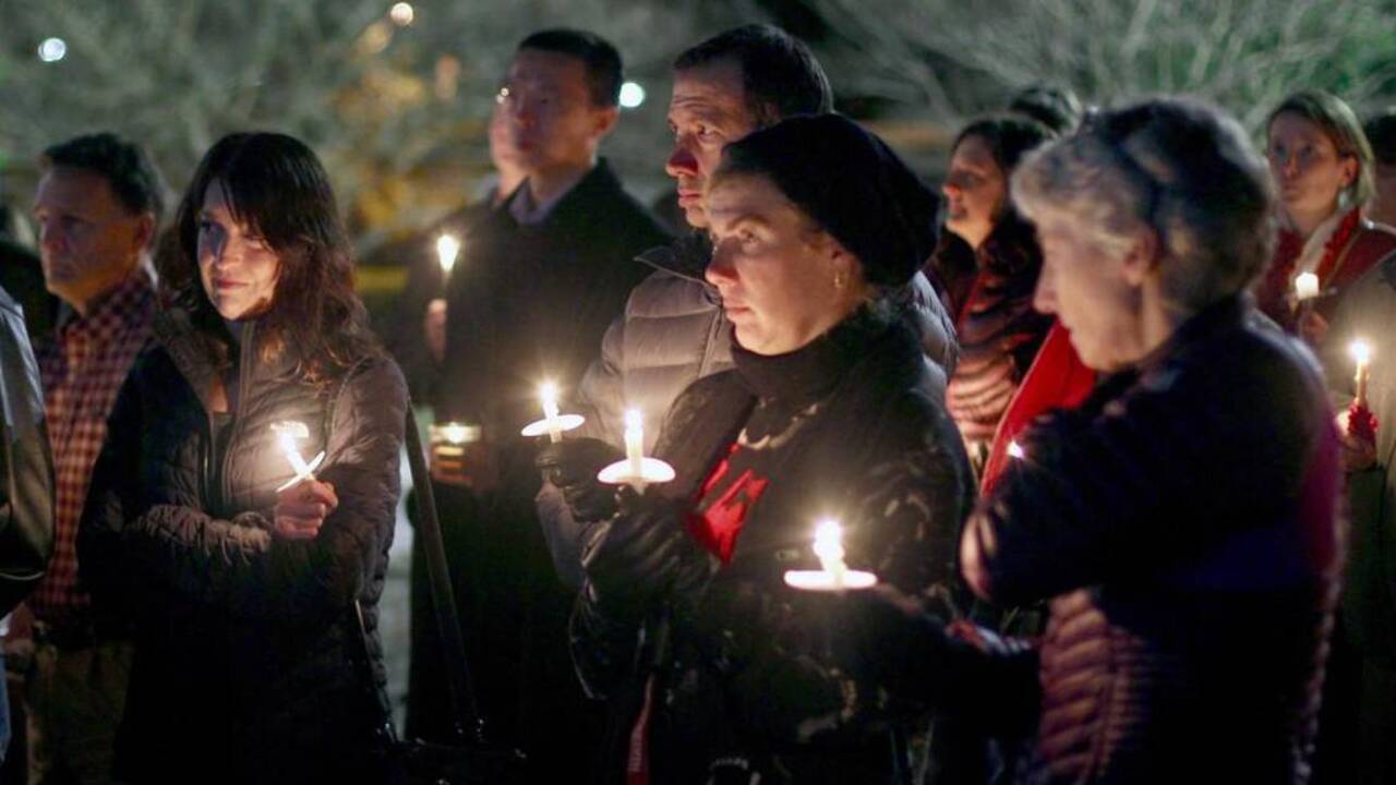 Supporters gather for candlelight vigil for critically injured Cary cyclist