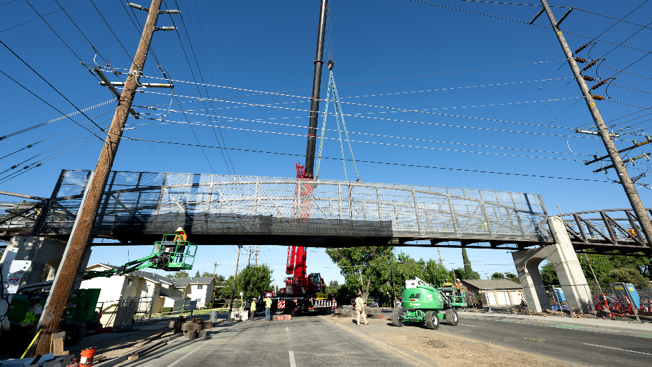 See the placement of new Virginia Trail bridge over Standiford