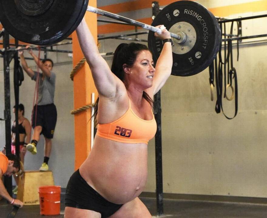 Crossfit trainer is 9 months pregnant and still lifting 205 pounds