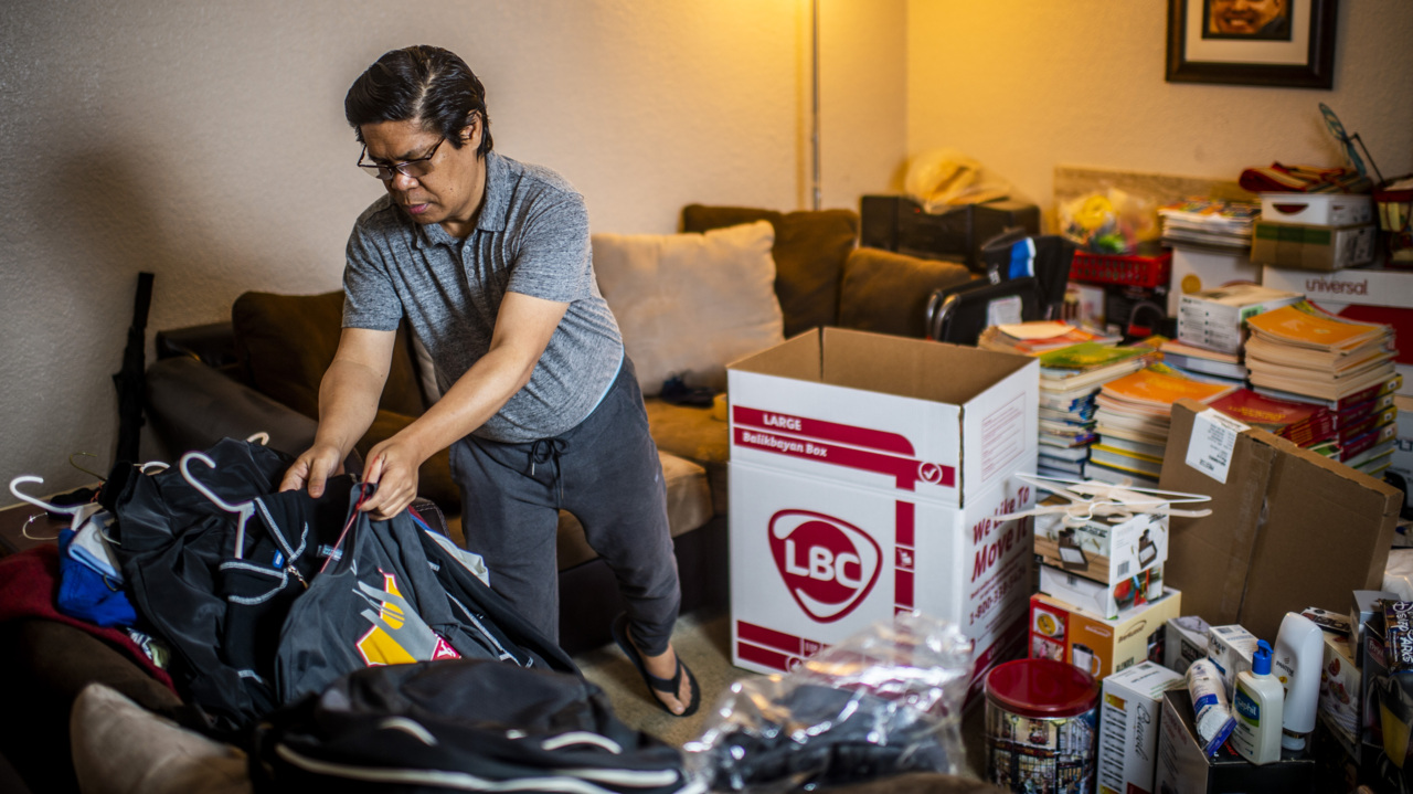 Watch this father pack a Balikbayan box for his daughter in the Philippines