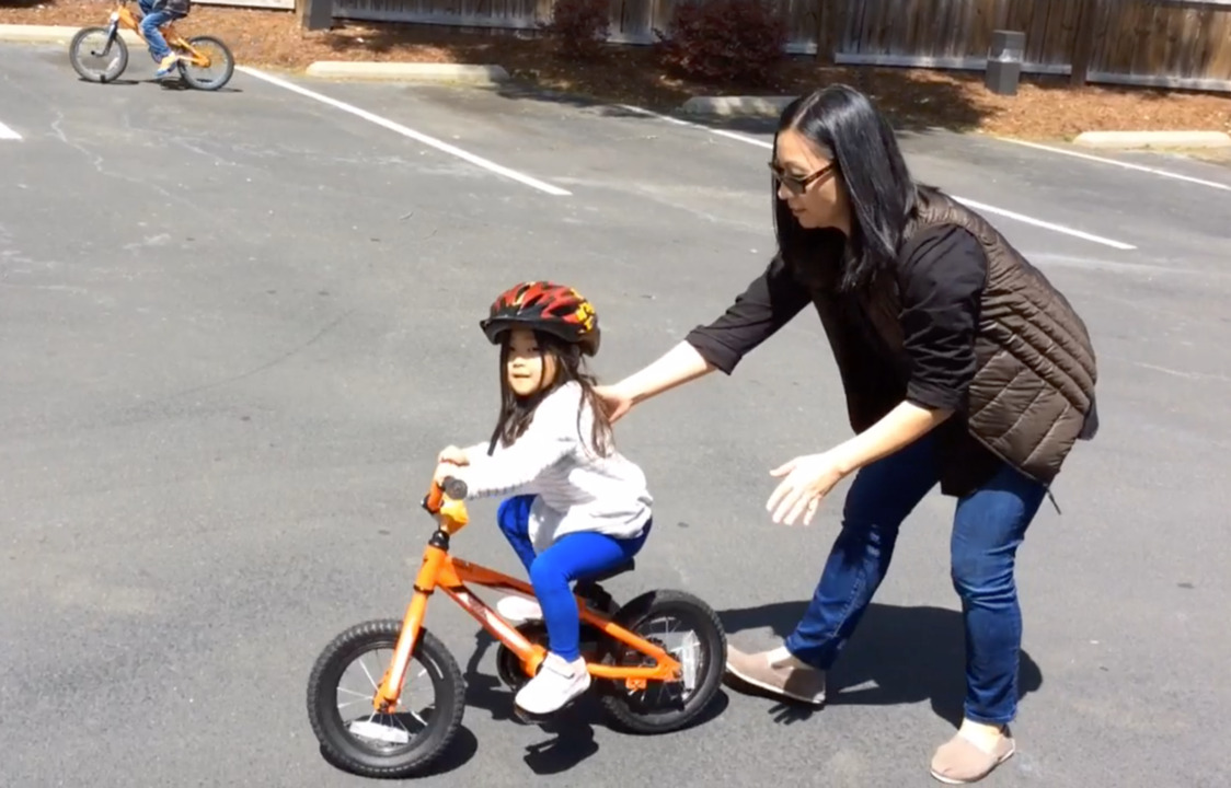 Maya Learns To Ride A Bike at Carrboro Open Streets Festival