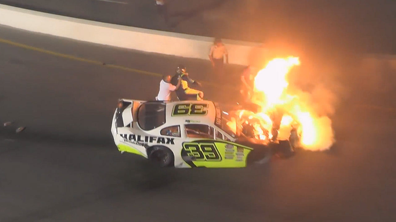 Father pulls son from burning car after race crash