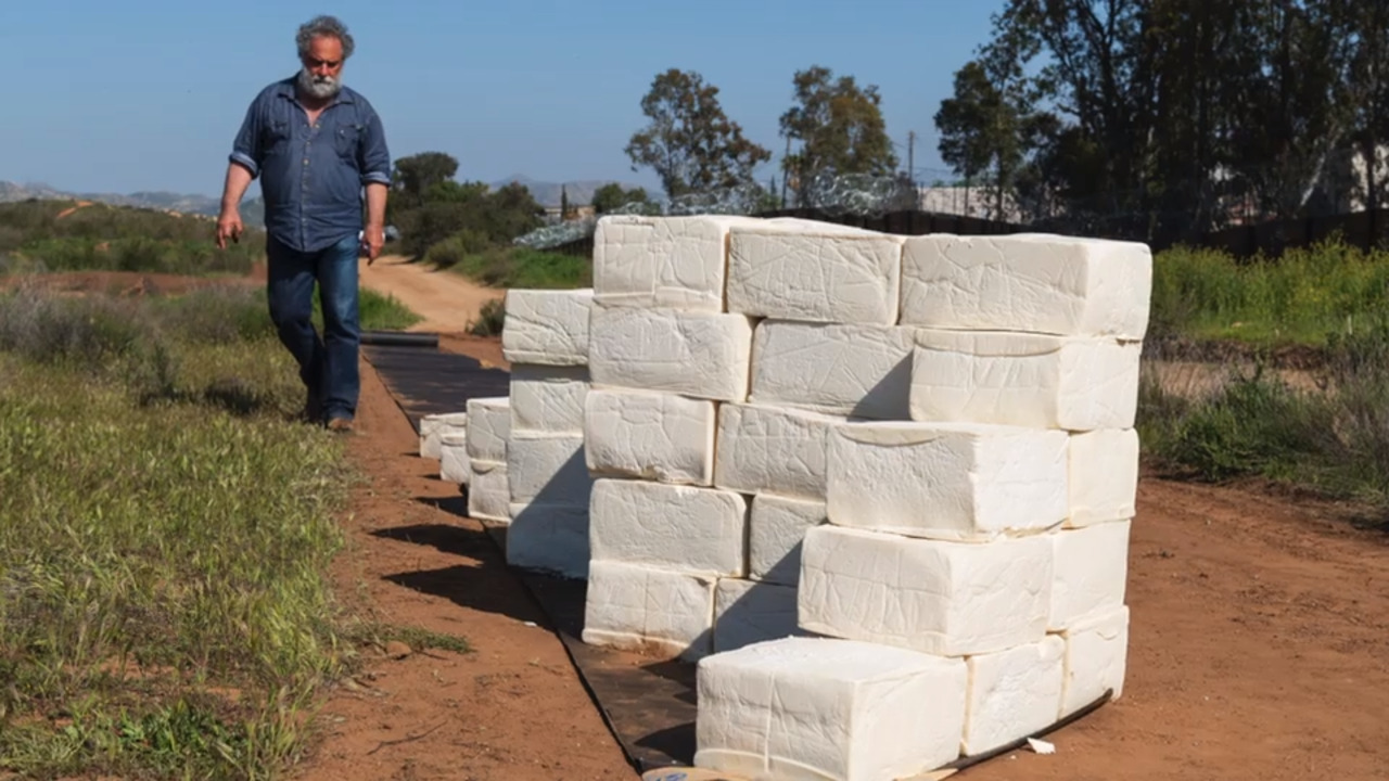 LA artist builds 6-foot-high cheese wall on the US-Mexico border in California