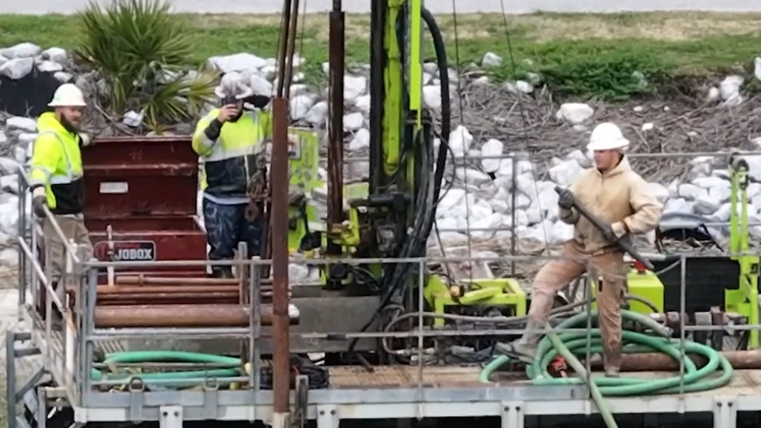 A barge and workers are near the bridge to Hilton Head. Here's what they are doing