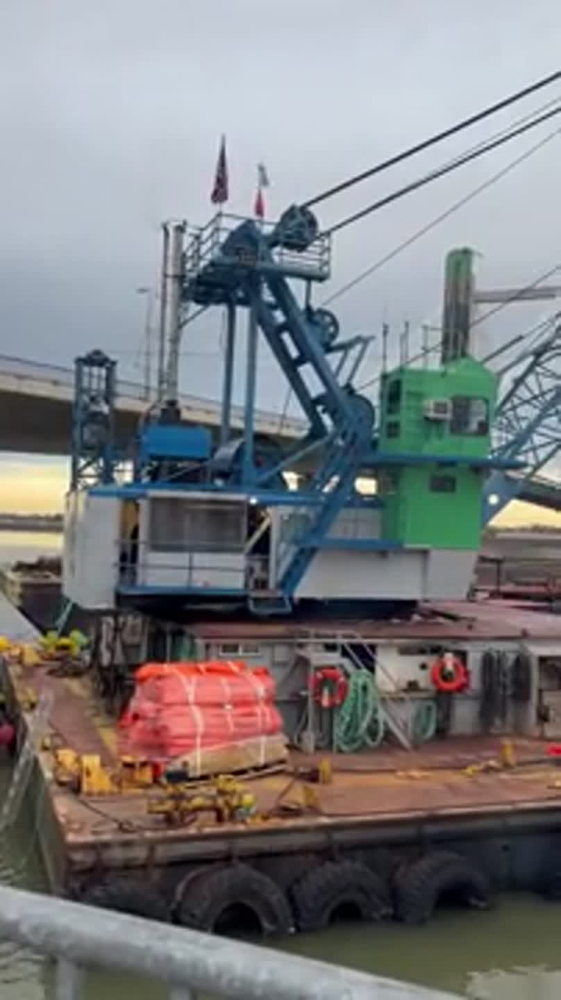 Why a barge, crane and divers are under the cable bridge