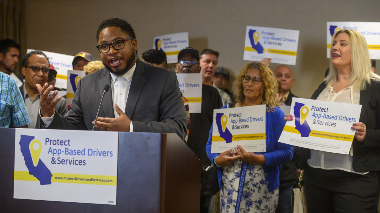 Drivers sue Uber for back pay, accelerating fight over California gig economy law