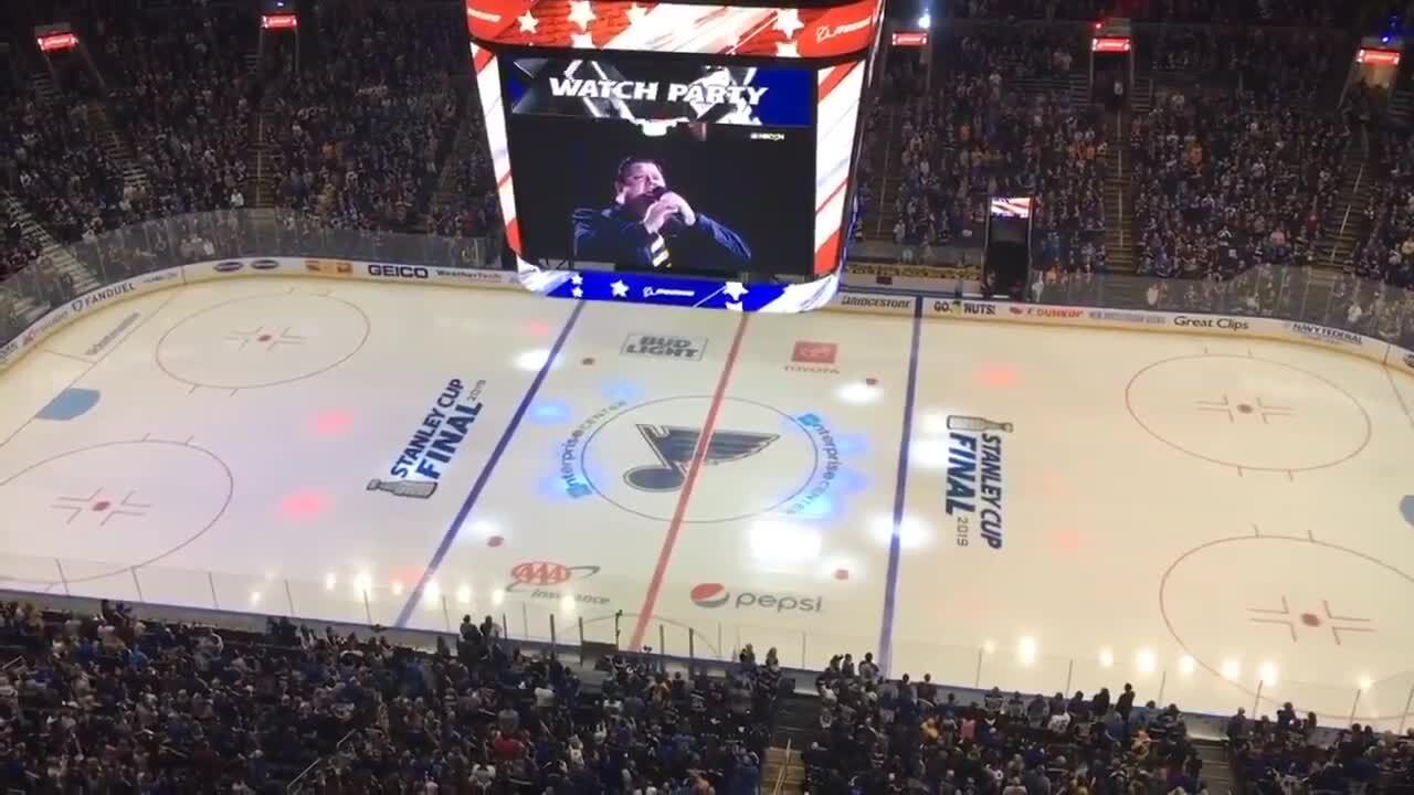 St. Louis Blues fans sing National Anthem when game feed goes out at Stanley Cup watch party