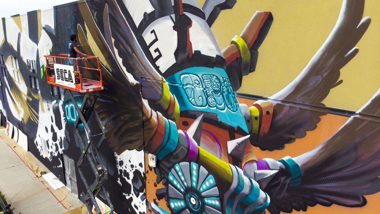 Quetzalcoatl emerges from mural on Hispanic Cultural Center of Idaho building