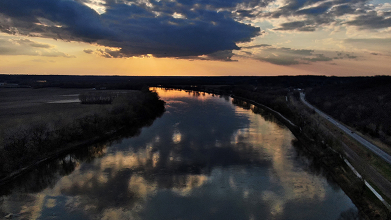 A moment of beauty in a time of turmoil-Take flight for a bird’s-eye view of the tranquil Missouri River near sunset