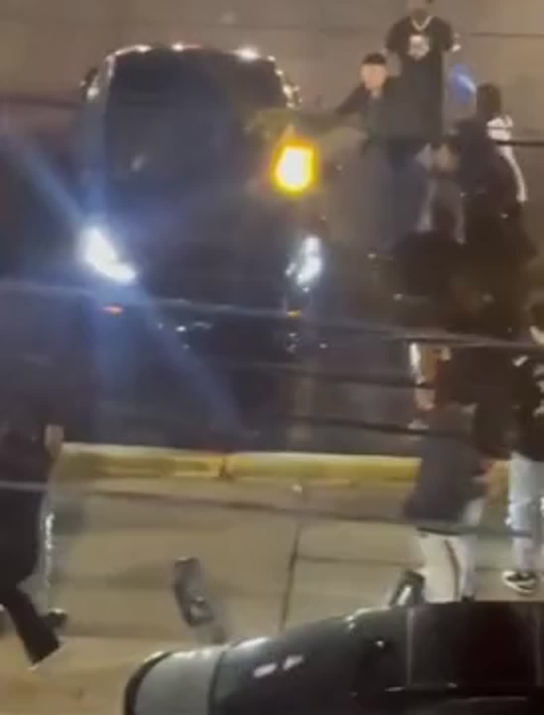 Surveillance video shows driver running into crowd in downtown Lexington