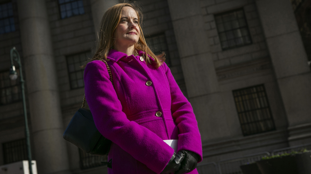 As Ghislaine Maxwell’s family is escorted into the courthouse, an accuser waits in the cold